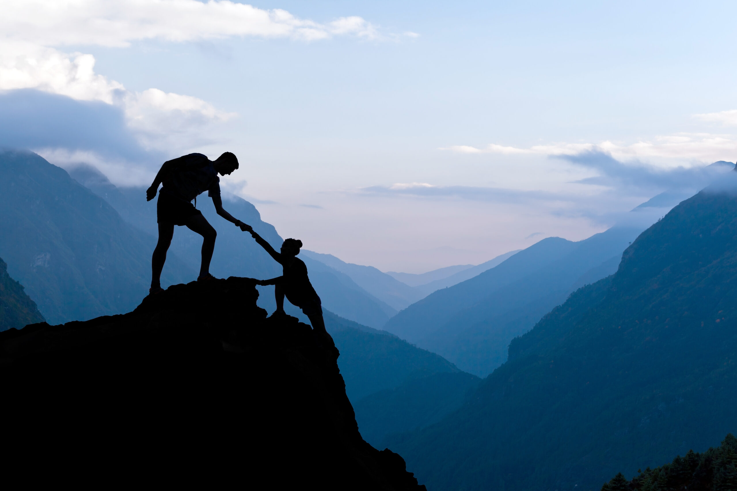 Teamwork couple helping hand trust assistance silhouette